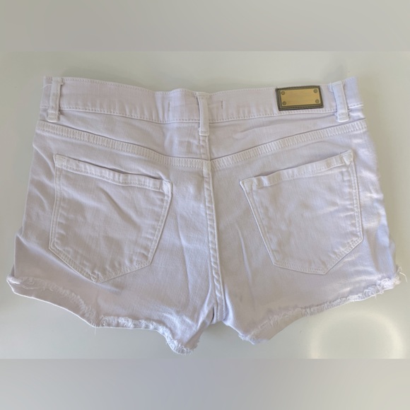 Powder, pink colored jean shorts with studs - Picture 2 of 3